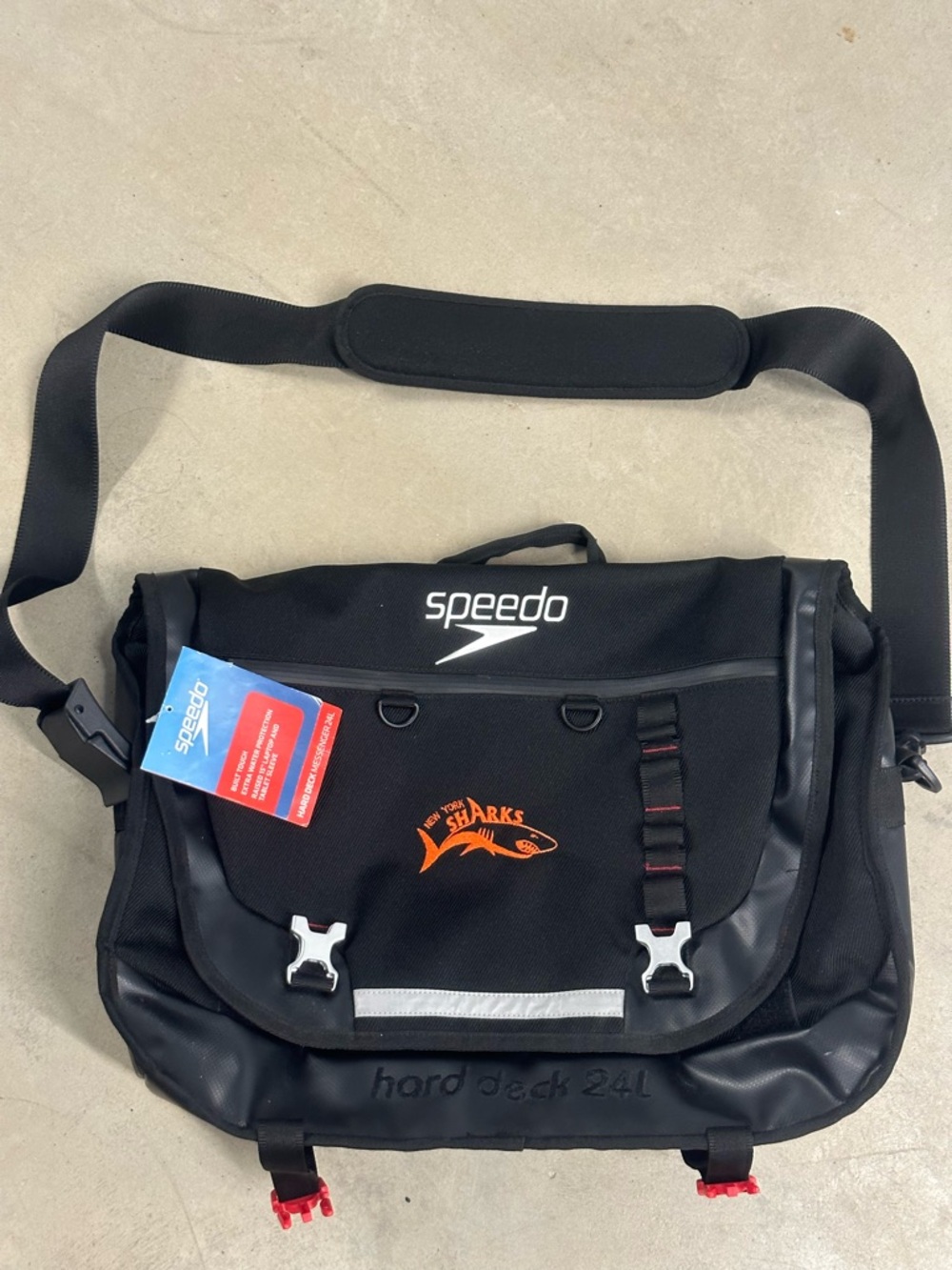 NWT Speedo Hard Deck Black Messenger Bag with Orange Logo Accent